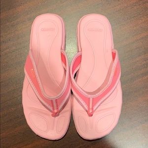 Reebok flip-flops. Pink.  Length is 10”.